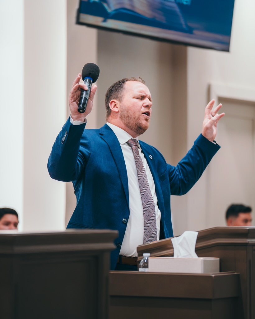 Preacher delivering a message at Voice of Truth Tabernacle
