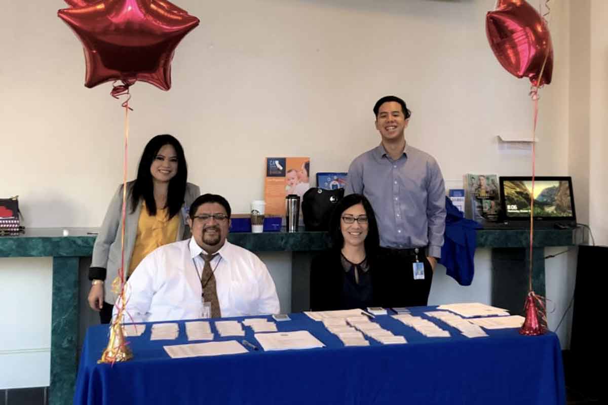 Personnel Employees tabling Day One event. 