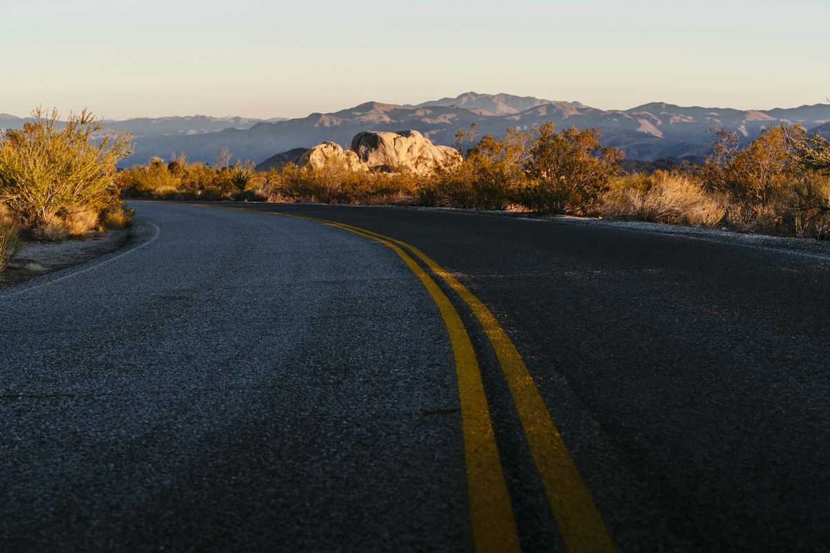 A scenic mountain road empty waiting for exploring travel concept