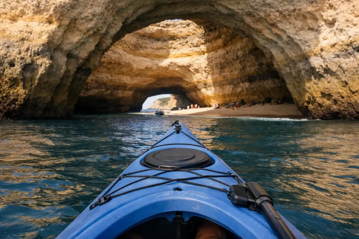 Kayak navigating through a scenic cave with sunlight streaming in.