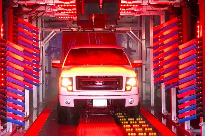 truck in car wash with red lights
