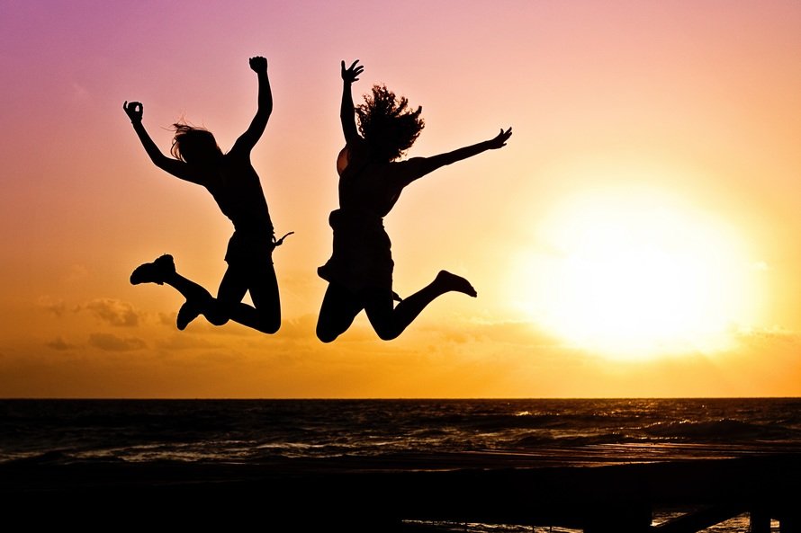 image of happy girls on the beach