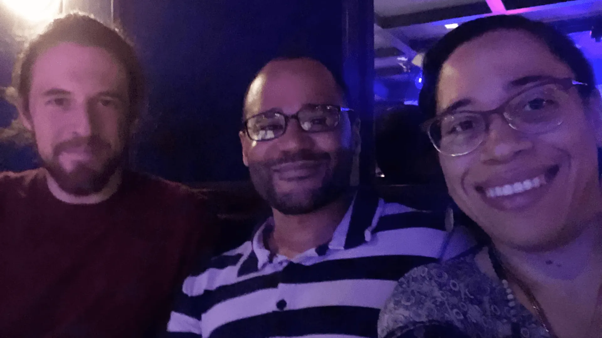 Joe, Rosa, and Matias taking a selfie at a comedy club