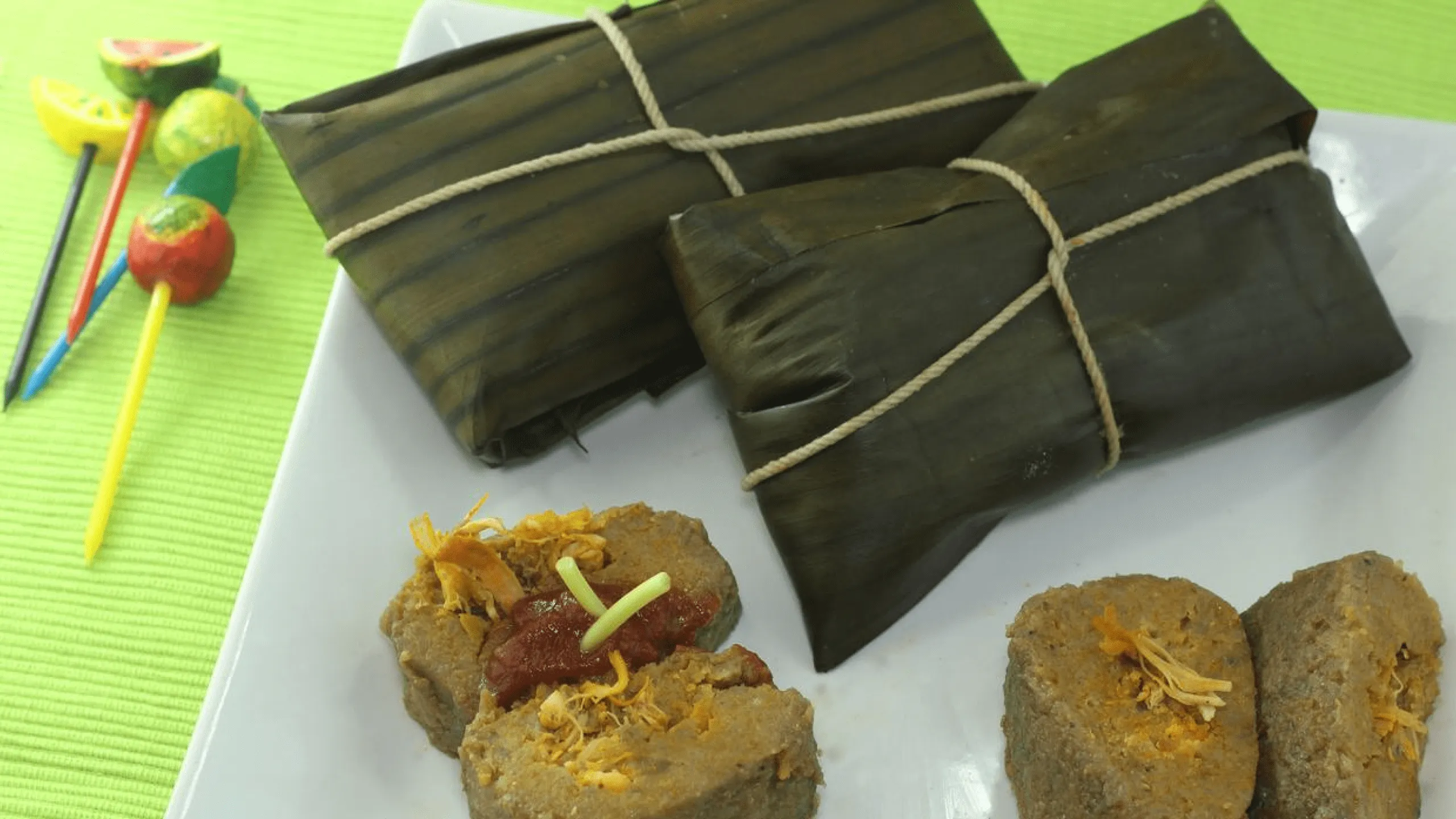 Screenshot of pasteles wrapped in banana leaf.