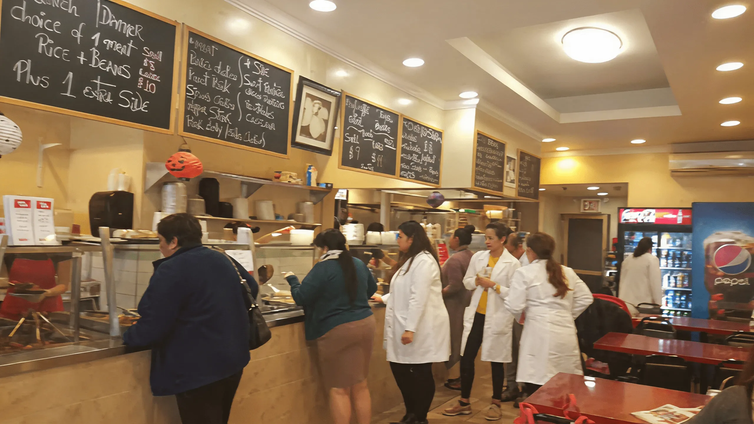 Screenshot of Latin Bites interior with customers, including NYP hospital staff.