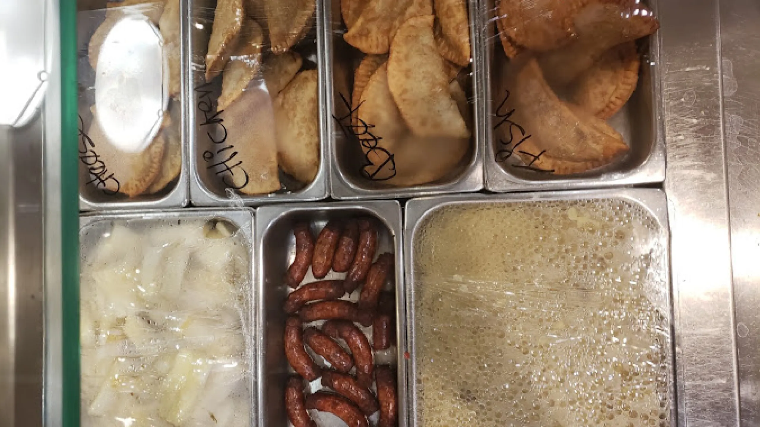 Screenshot of assorted empanadas, plantains, sausages, and mangú.
