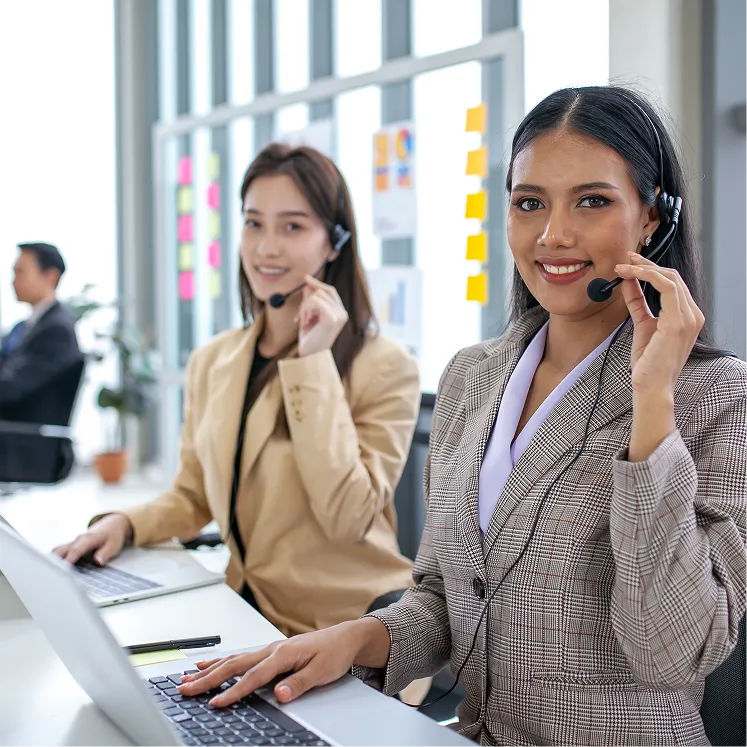 two formal woman with headset