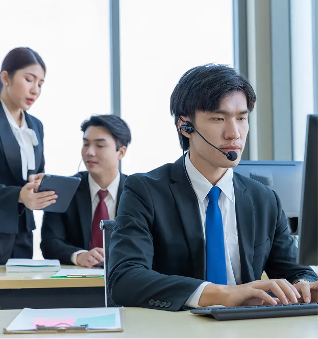 employees in suit and working at the office