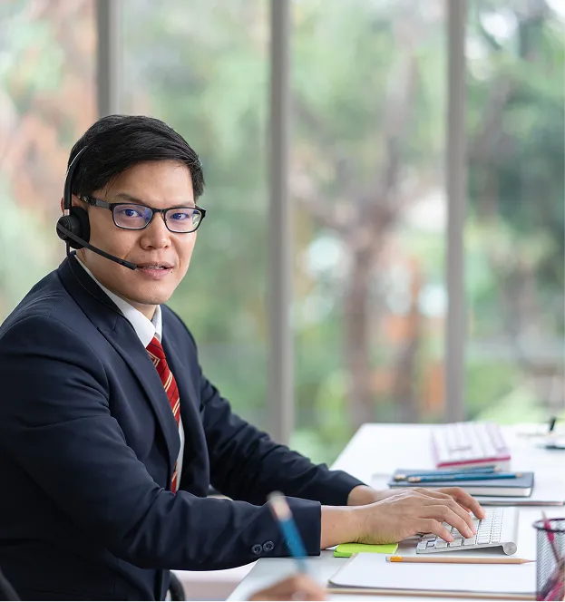 a man in a suit with a headset