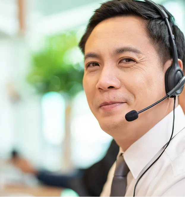 a smiling man with a headset