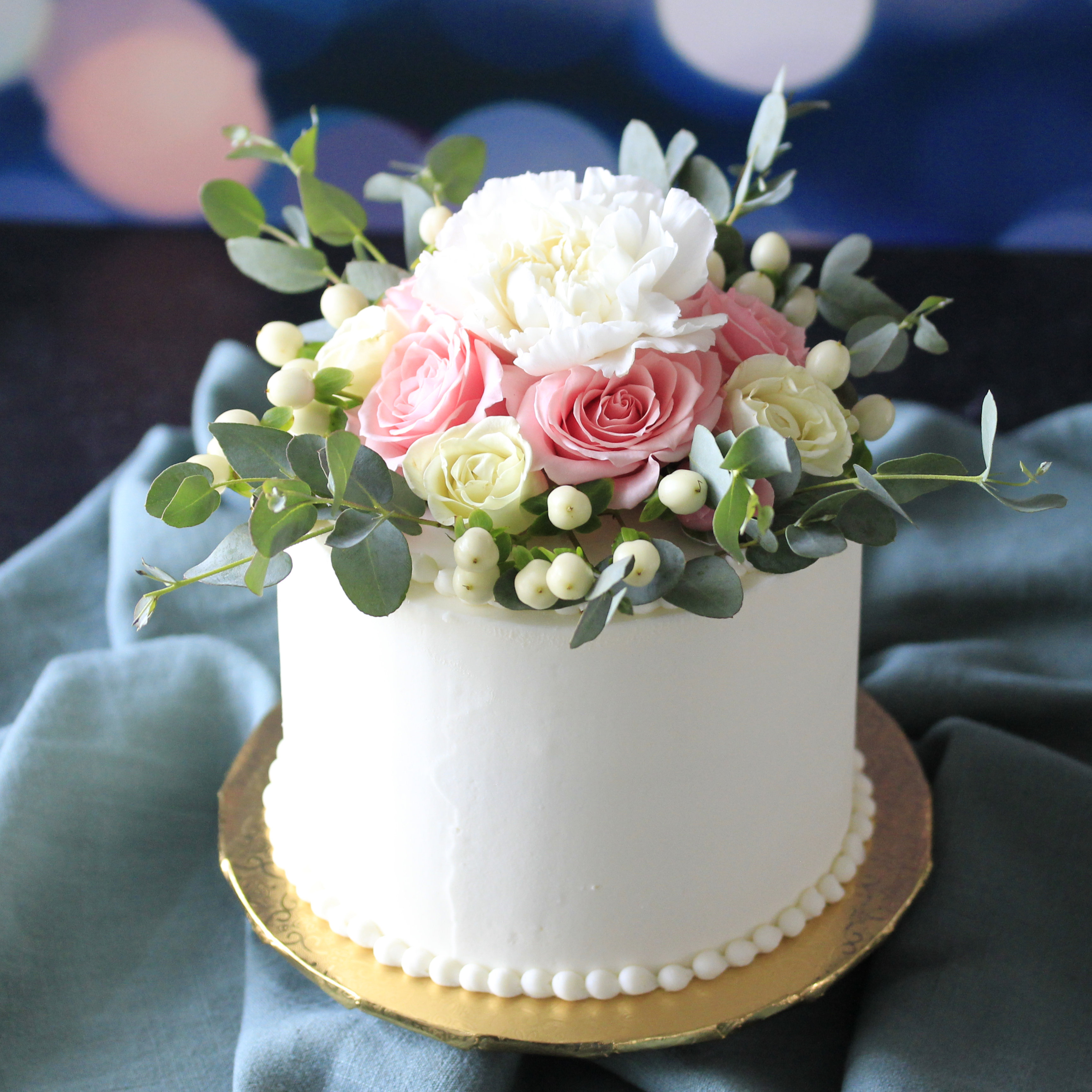 Perfect cake to celebrate a birthday or engagement. Fresh, seasonal flowers top this 6 inch buttercream cake in Van Alstyne, Texas