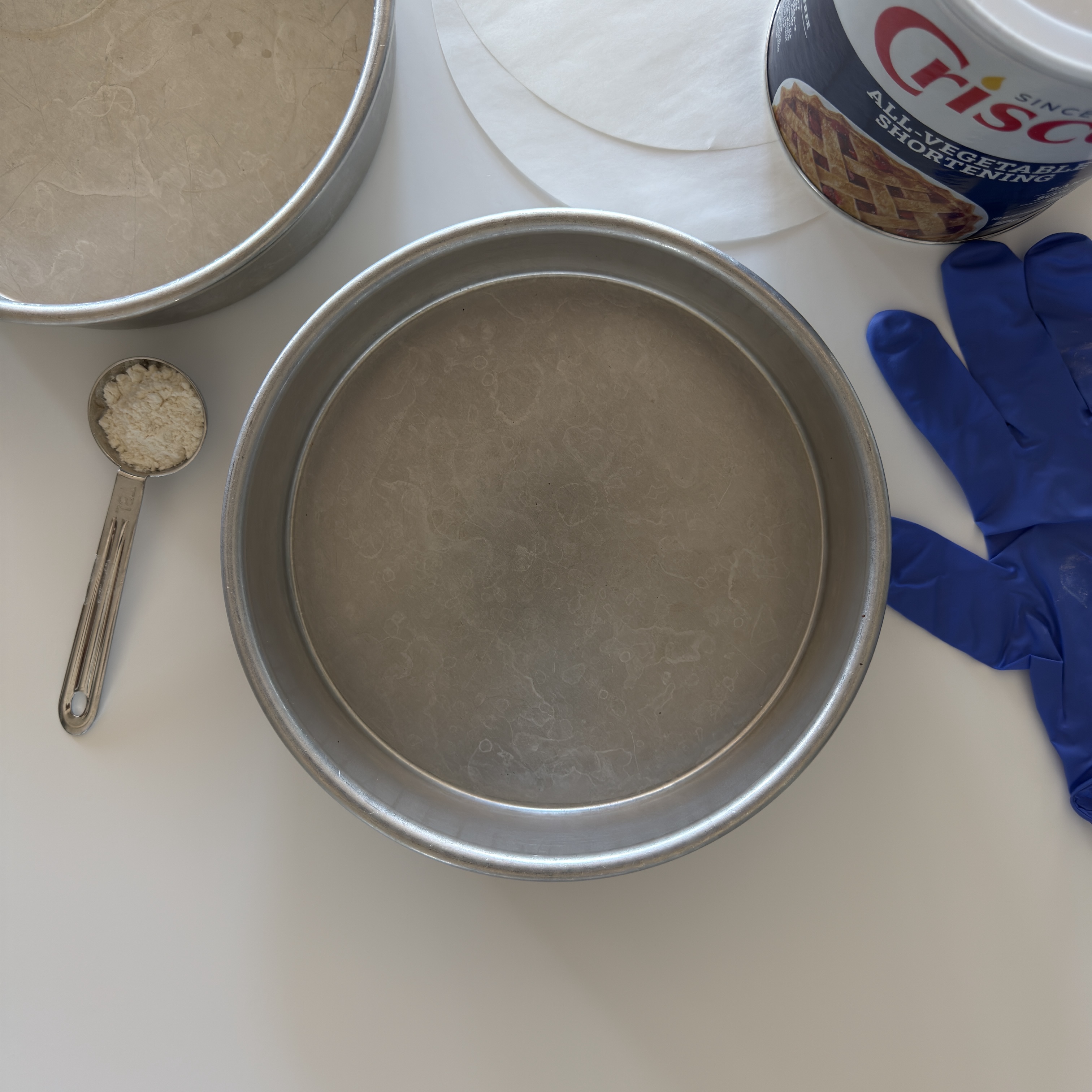 How to prepare a cake pan with shortening. Magic Line is my favorite cake pan brand.
