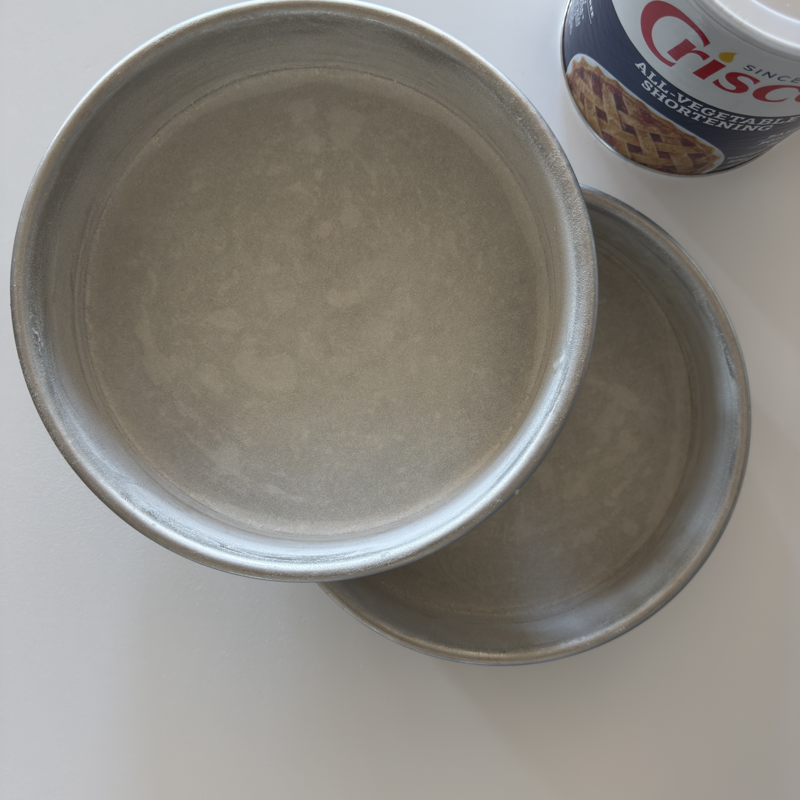Crisco is the shortening of choice for Love + Sugar and cake pans.