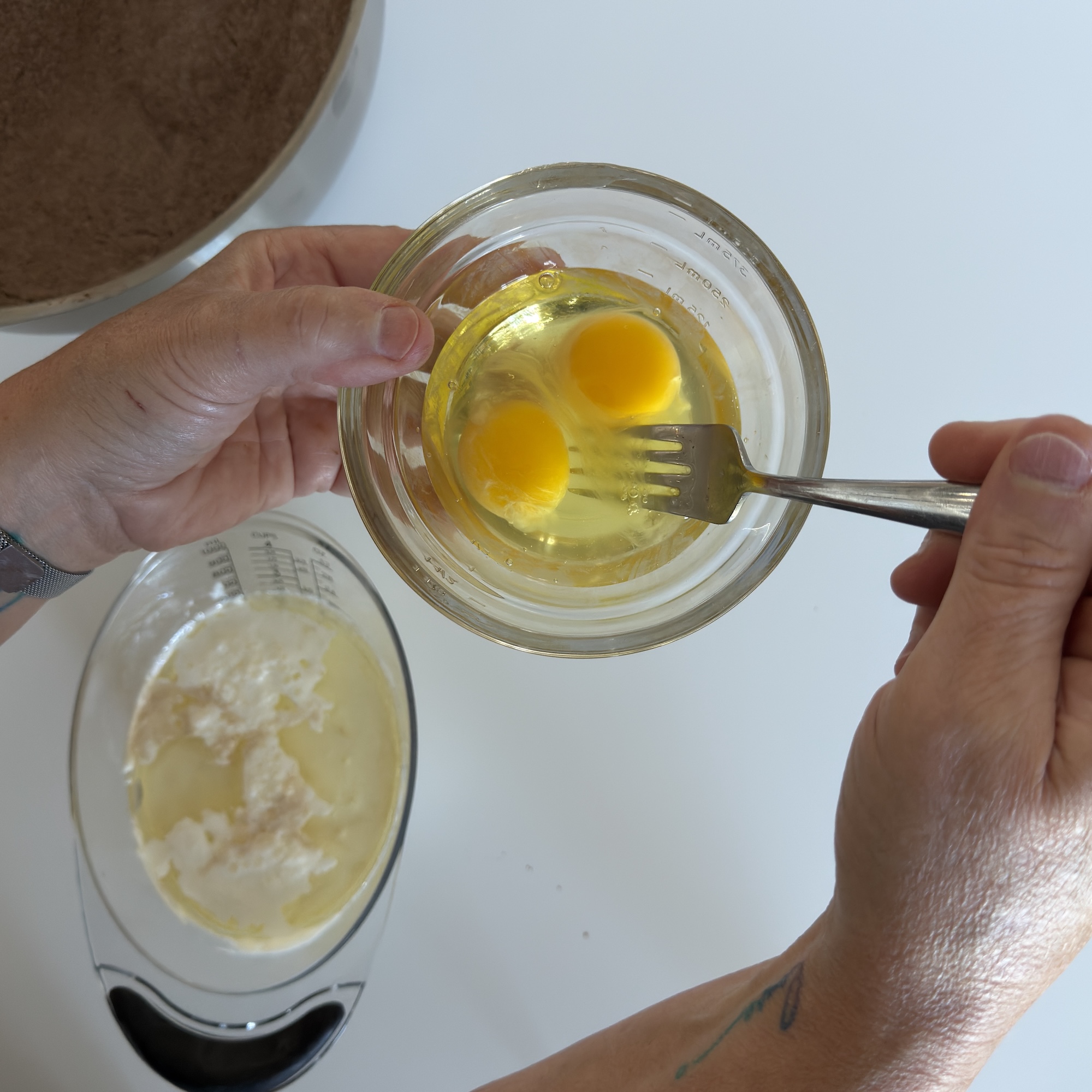Step 7: In a separate bowl, whisk together the 2 eggs, 8 oz heavy whipping cream, 3½ oz vegetable oil, and 3 tsp vanilla until smooth.