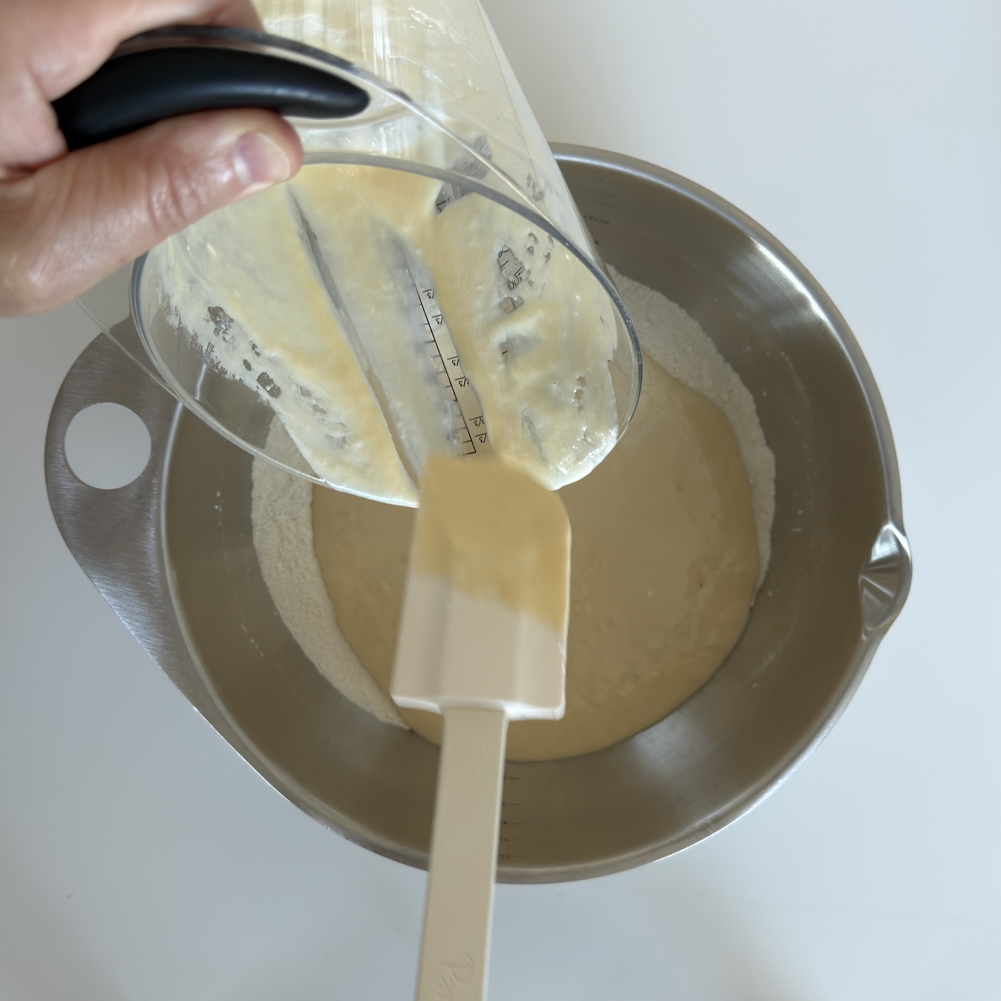 Pour the wet ingredients into the large bowl with the dry ingredients.