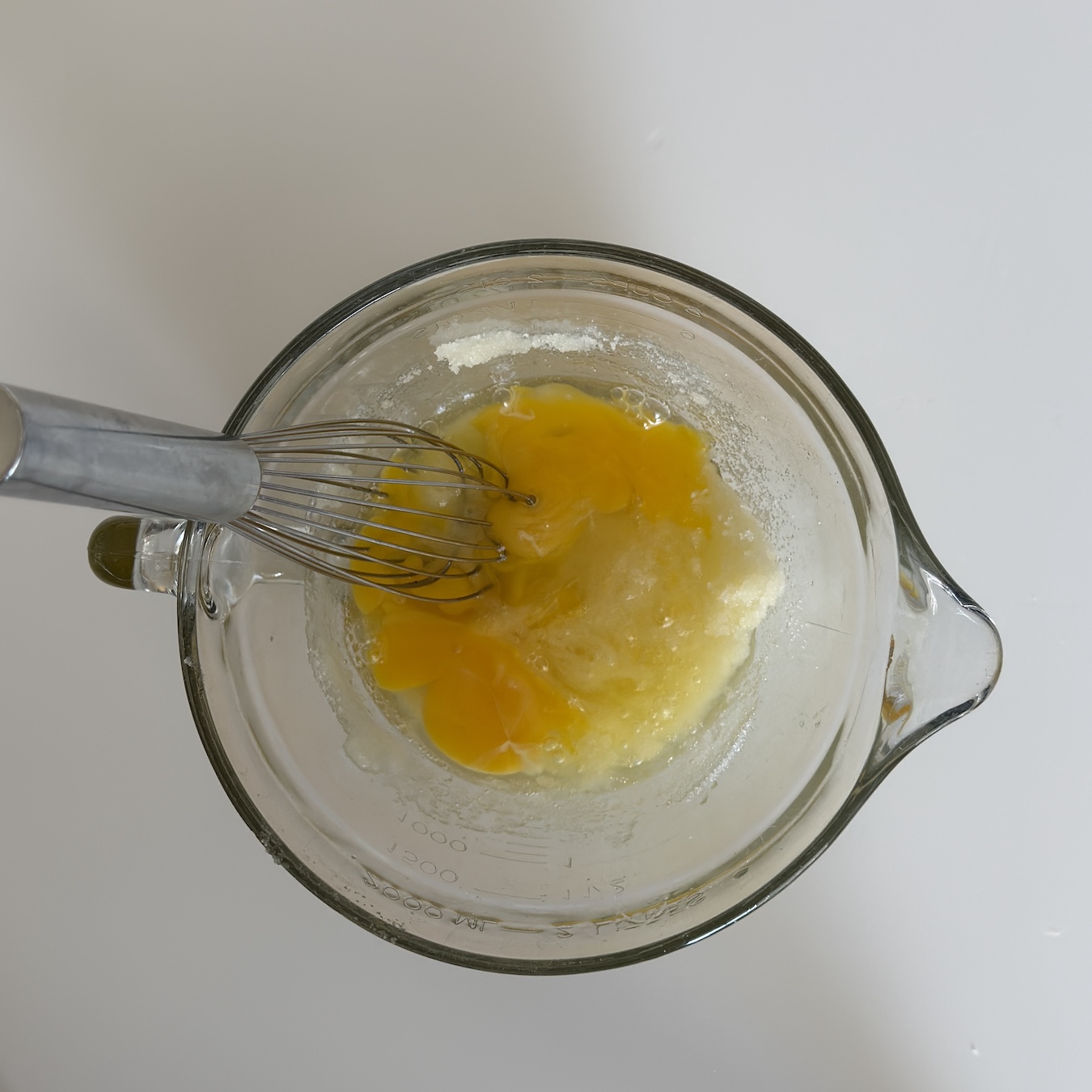 Step 4 Add the 2 eggs, and one egg yolk.