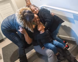 moms and kids hugging