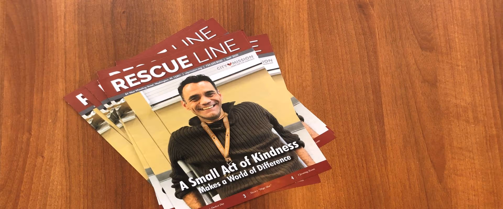 city mission newsletters sitting on desk