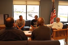 group of 5 male veterans in discussion group