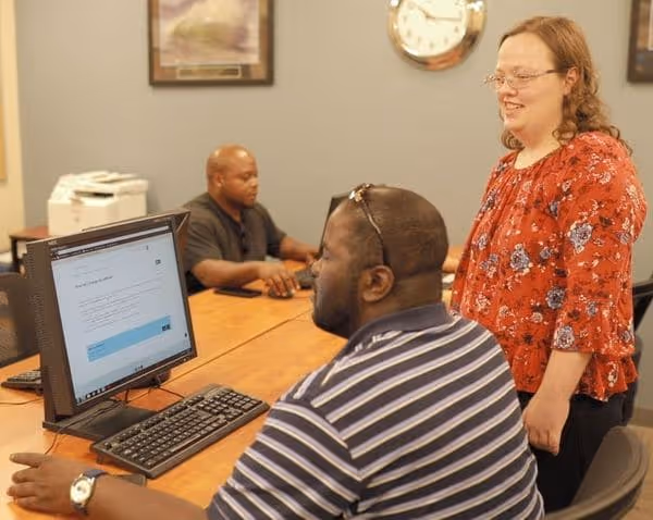 City Mission’s Career Training & Education Center manager provides instruction to a job searcher