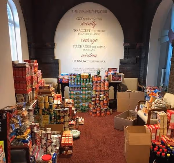 Canned and dry goods pile up in a Chapel adjacent room