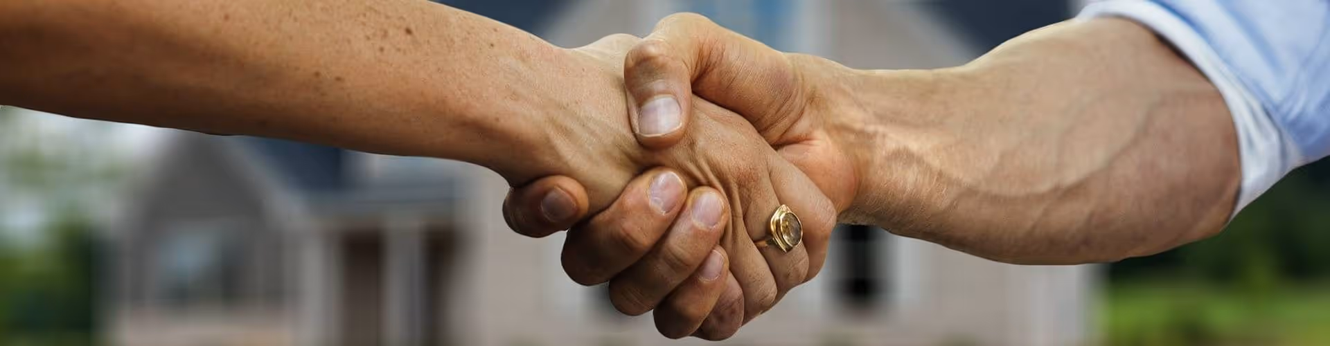 2 hands clenched in a handshake