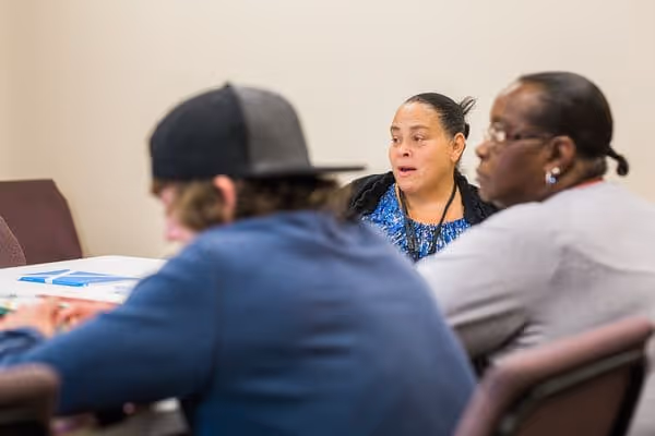 City Mission counselor in a discussion with a resident