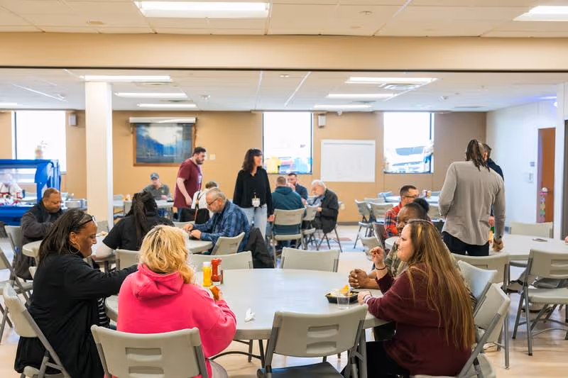City Mission counselor in a discussion with a resident