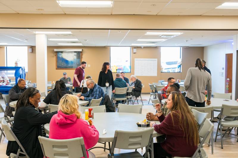 City Mission counselor in a discussion with a resident