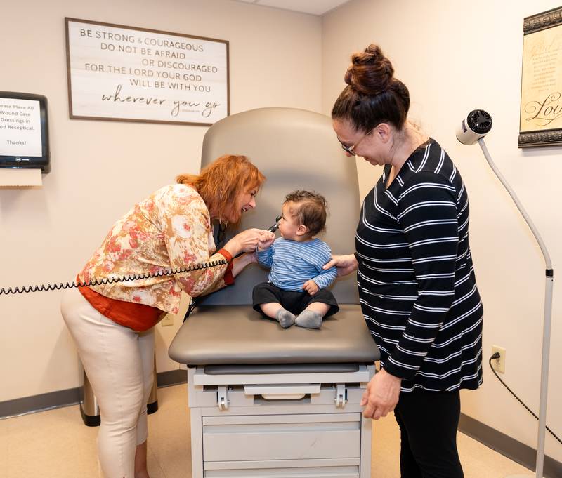 The City Mission's head nurse examines a resident