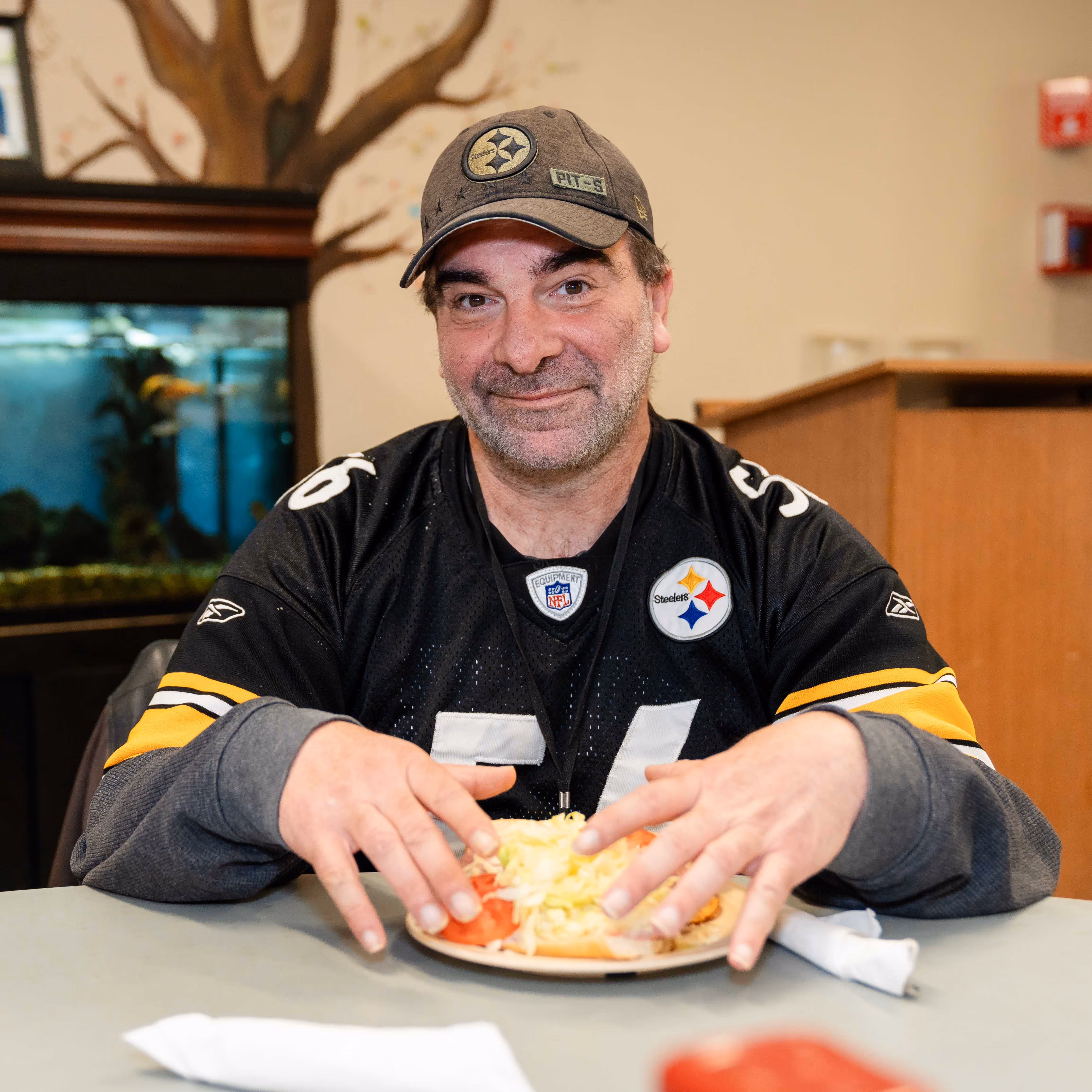 a beautiful little girl stares at her empty plate