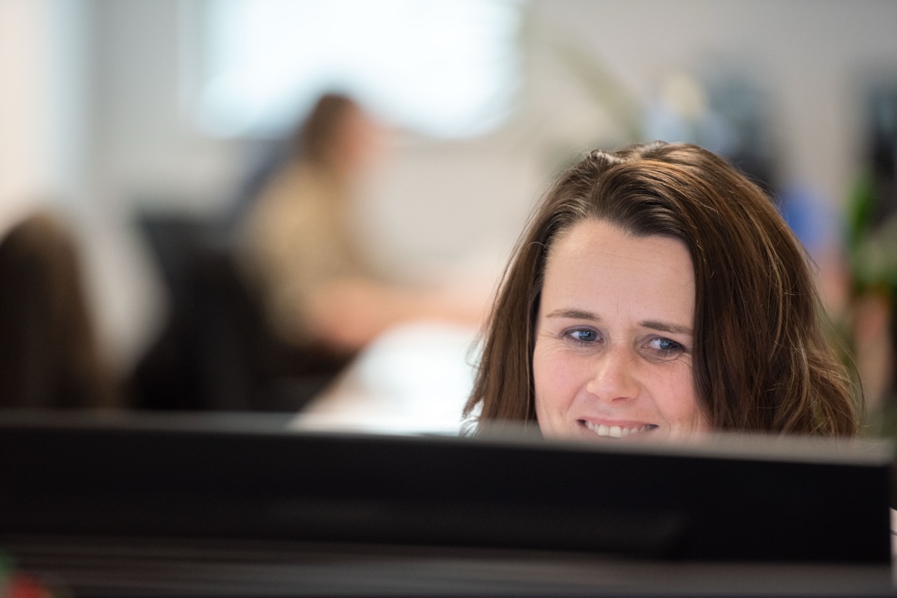 A colleague working at a computer