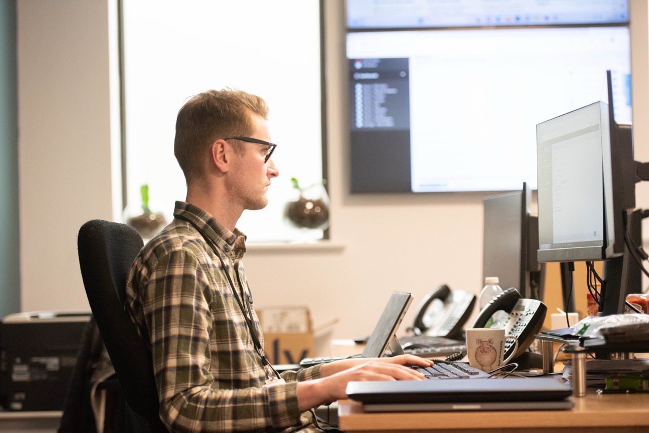 A colleague working at a desk