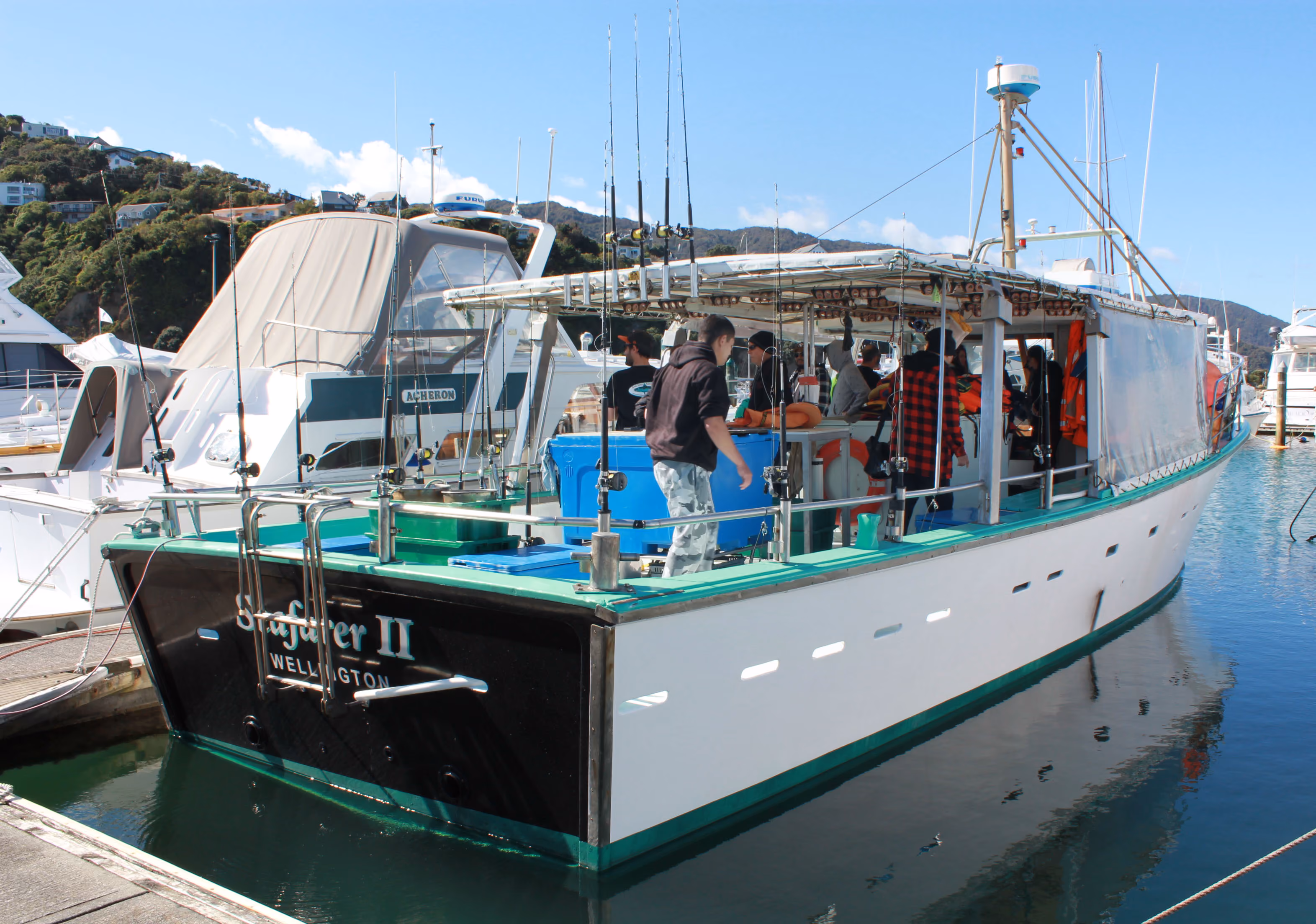 A dozen people, plus their IDEA Services support staff, enjoy day's fishing courtesy of the IHC Mana-Kapiti Association.