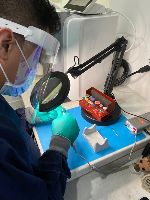 man looking at teeth whitening chart