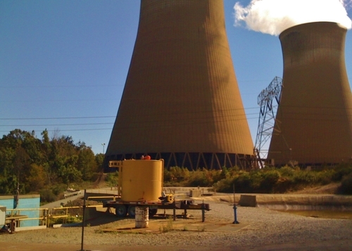 View of storage tank with nuclear power plants in the background