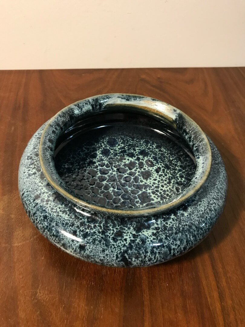 People mingling in pods in a virtual art gallery before an NFT auction talk