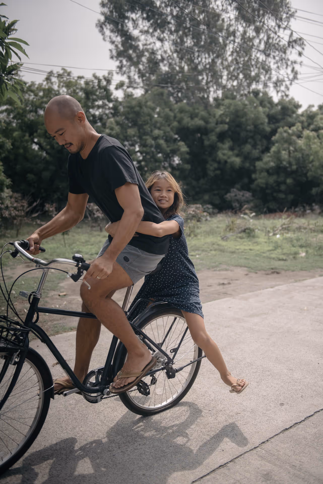 Kiddo and Cadence Cosio on a bike in La Union, photo by Tarish Zamora