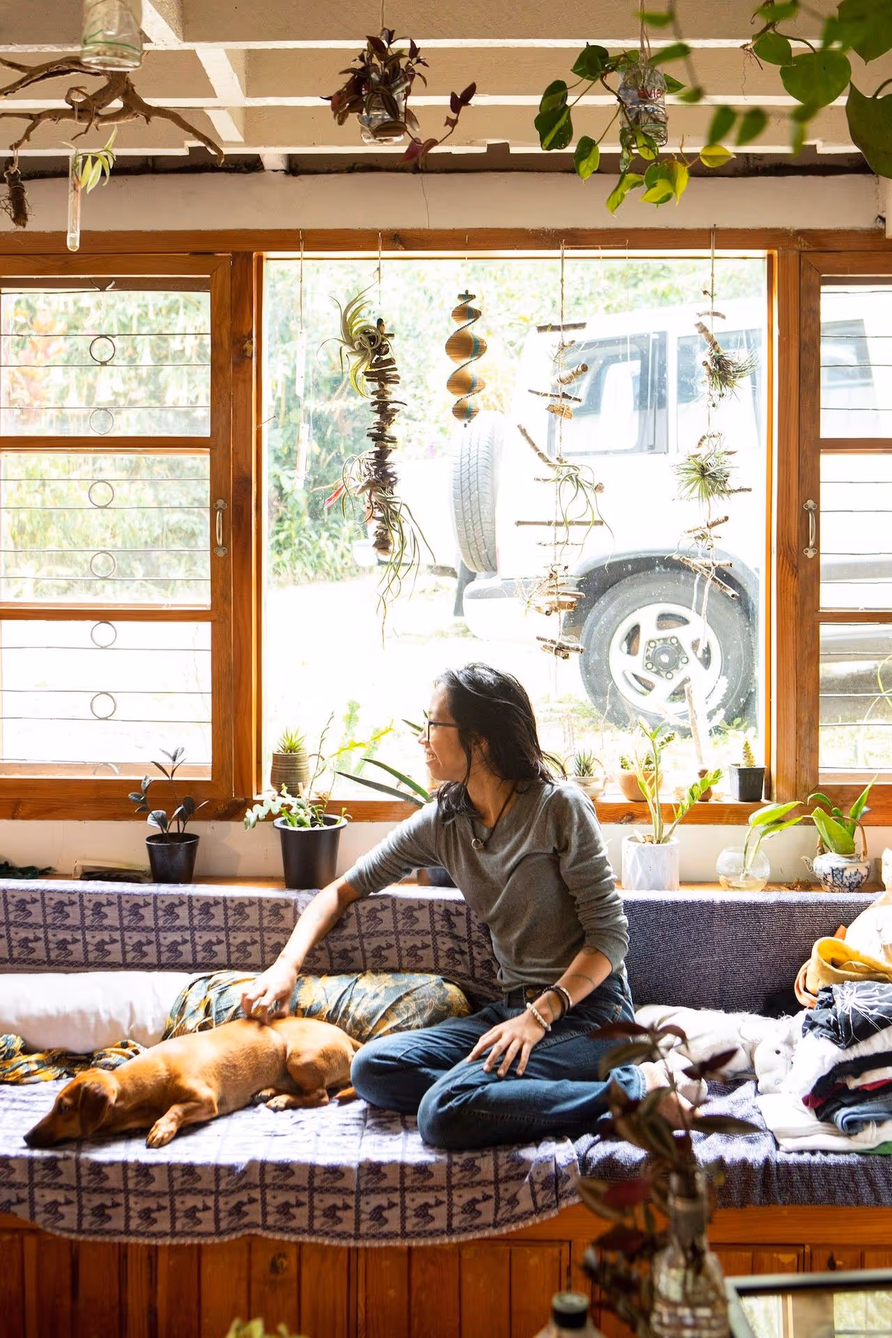 Solana Perez at home with her dog, photo by Miguel Nacianceno