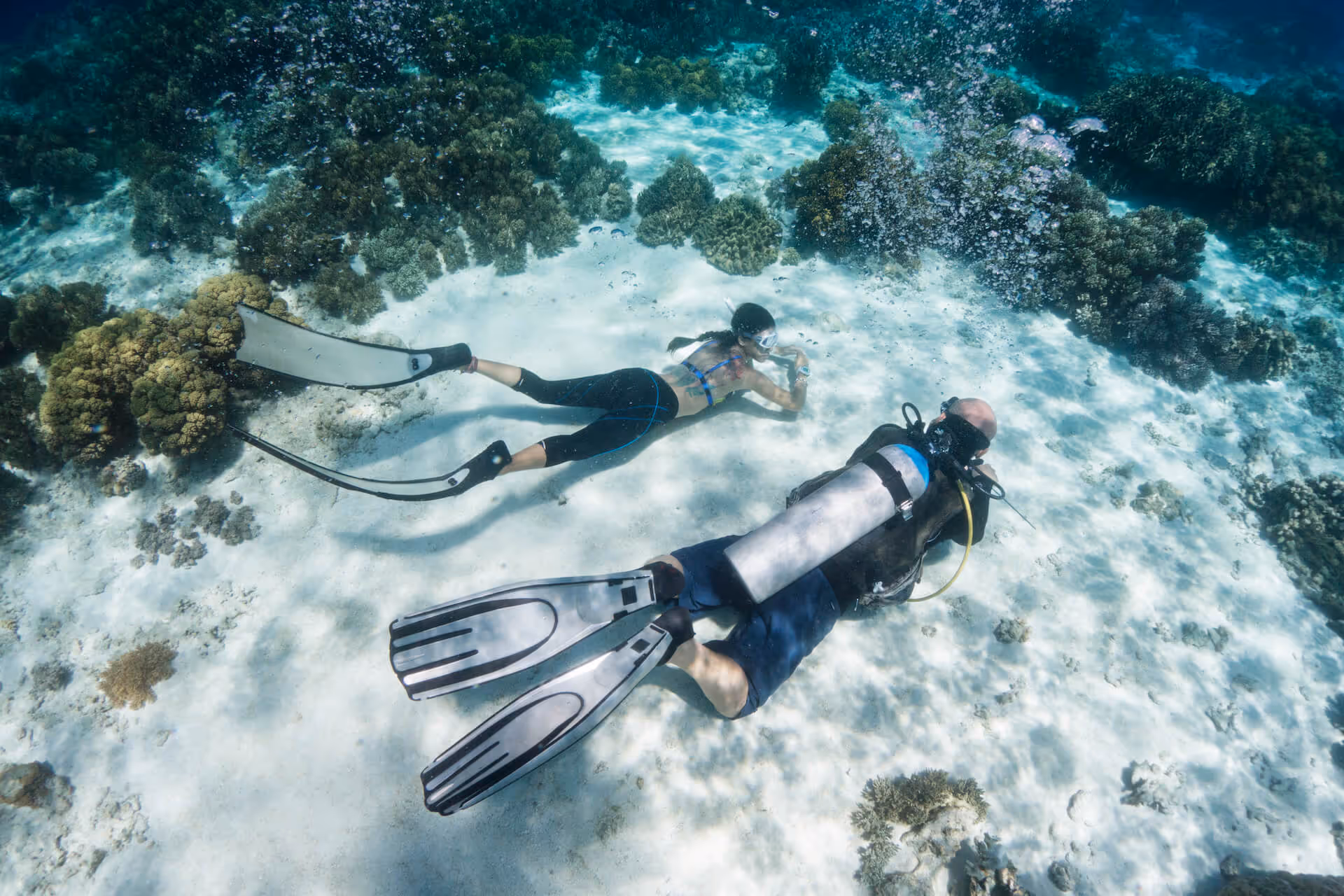 Tara Abrina and Rene Juntereal diving by Apo Reef for marine conservation efforts, photo by Francisco Guerrero