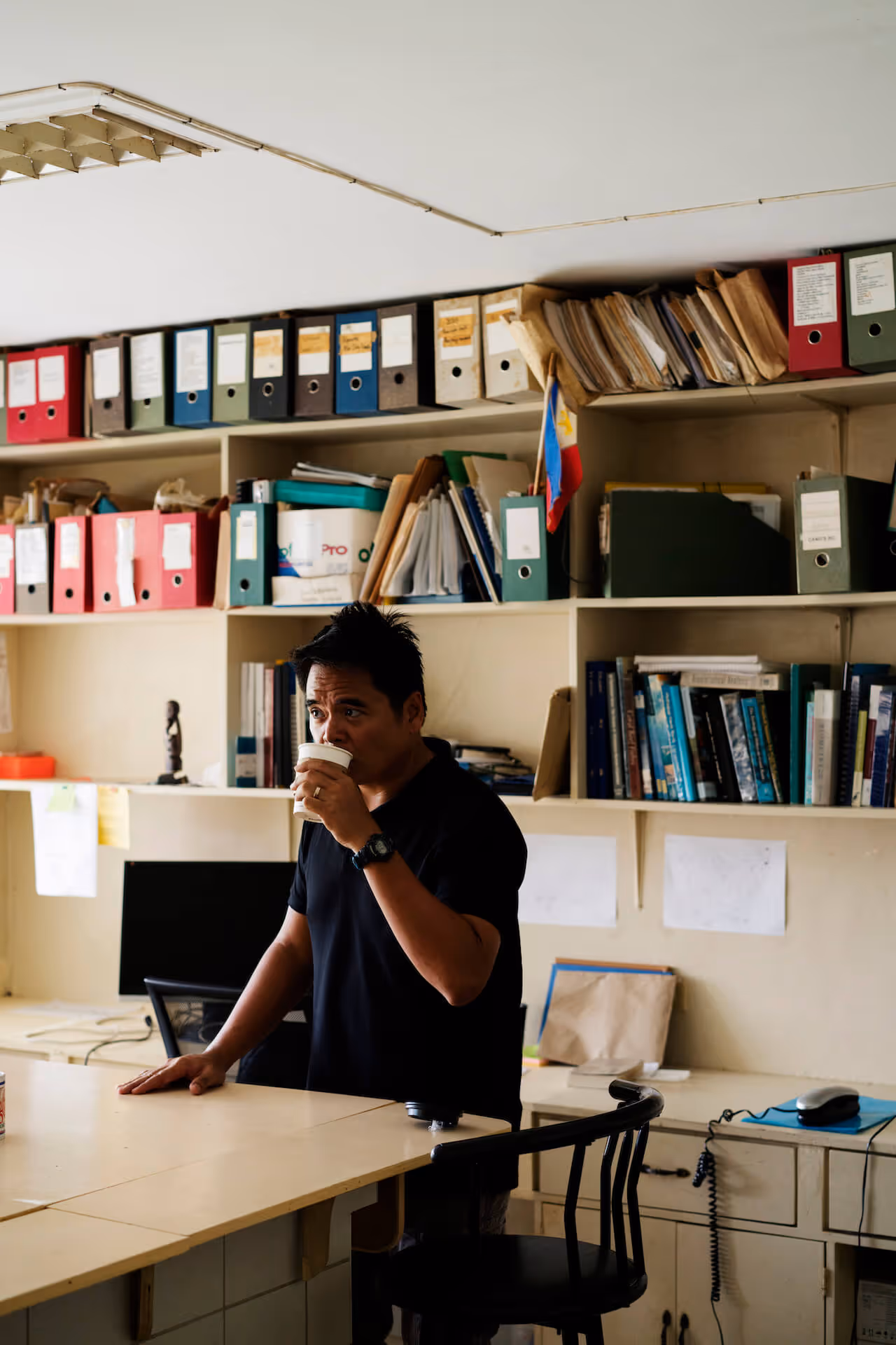 Dr Rene Abesamis sips his coffee in Siliman University's laboratory, photo by Sonny Thakur