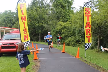 The fastest runner crossing finish line