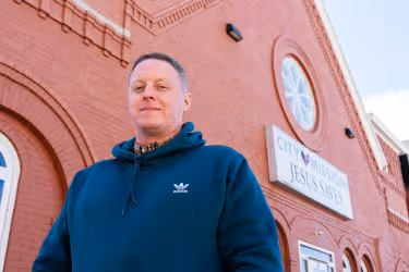 Patrick in front of City Mission's chapel