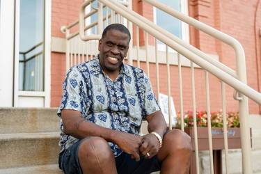 Eugene sitting on the steps at City Mission.