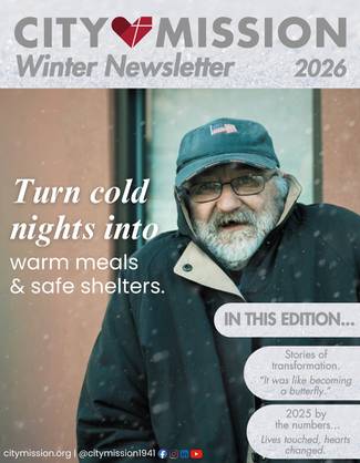 man outsid building in winter