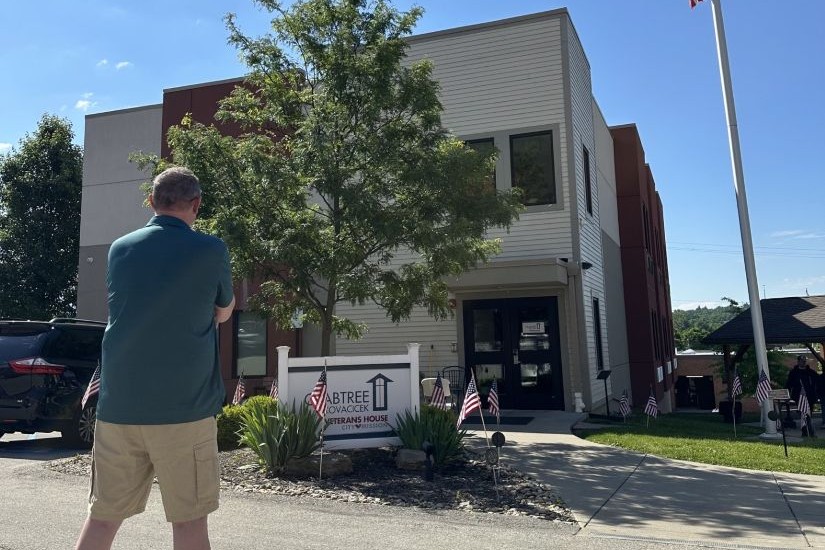 Bill in front of City Mission's Crabtree Kovacicek Veterans House