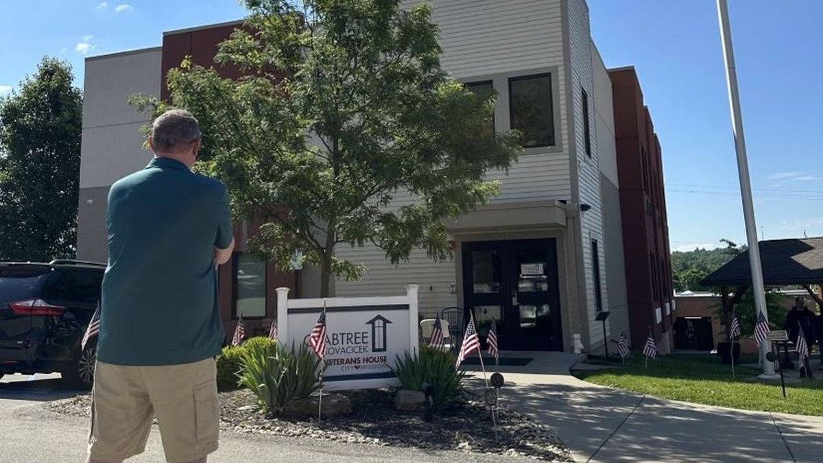 Bill in front of City Mission's Crabtree Kovacicek Veterans House