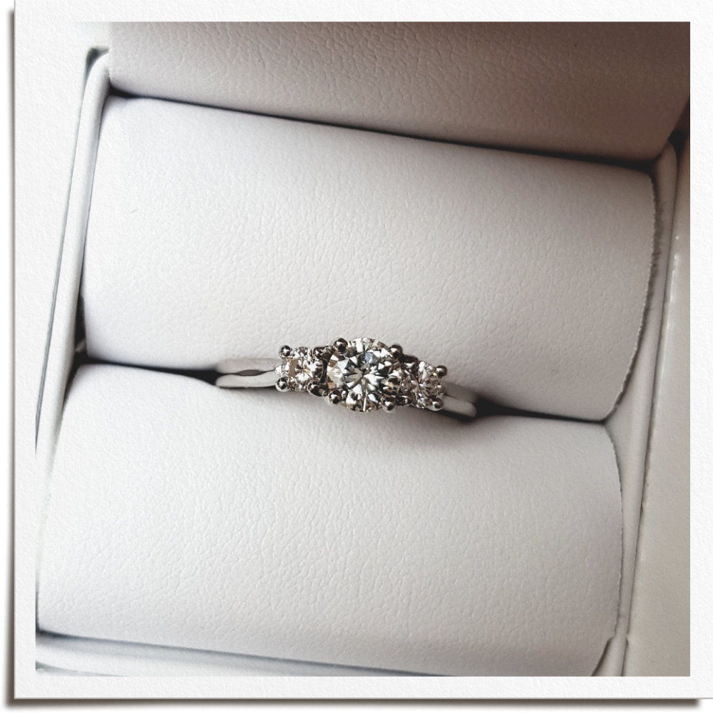 Diamonds from two old rings remodelled into one three stone engagement ring
