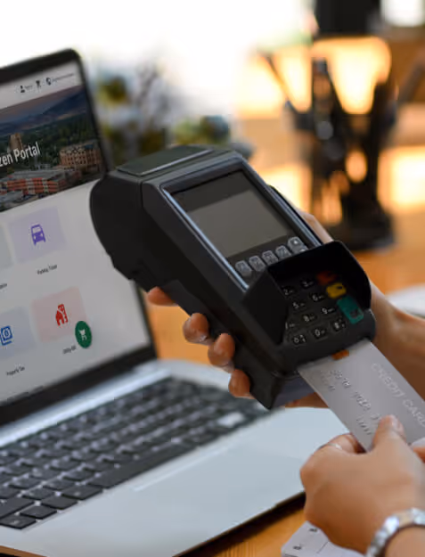 women at rec center front desk greeting members