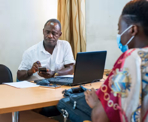 group of men playing basketball in a gym